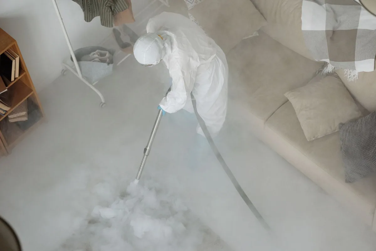 Biohazard cleanup technician in protective equipment, Duluth, WA
